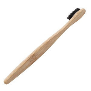 环保的天然竹牙刷，带有柔软的炭质刷毛，符合人体工程学的手柄弧形头